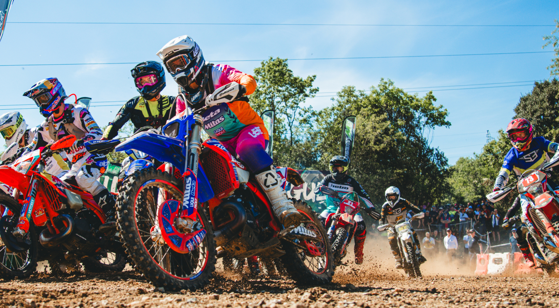 Hard enduro rider battling extreme terrain at golden hour