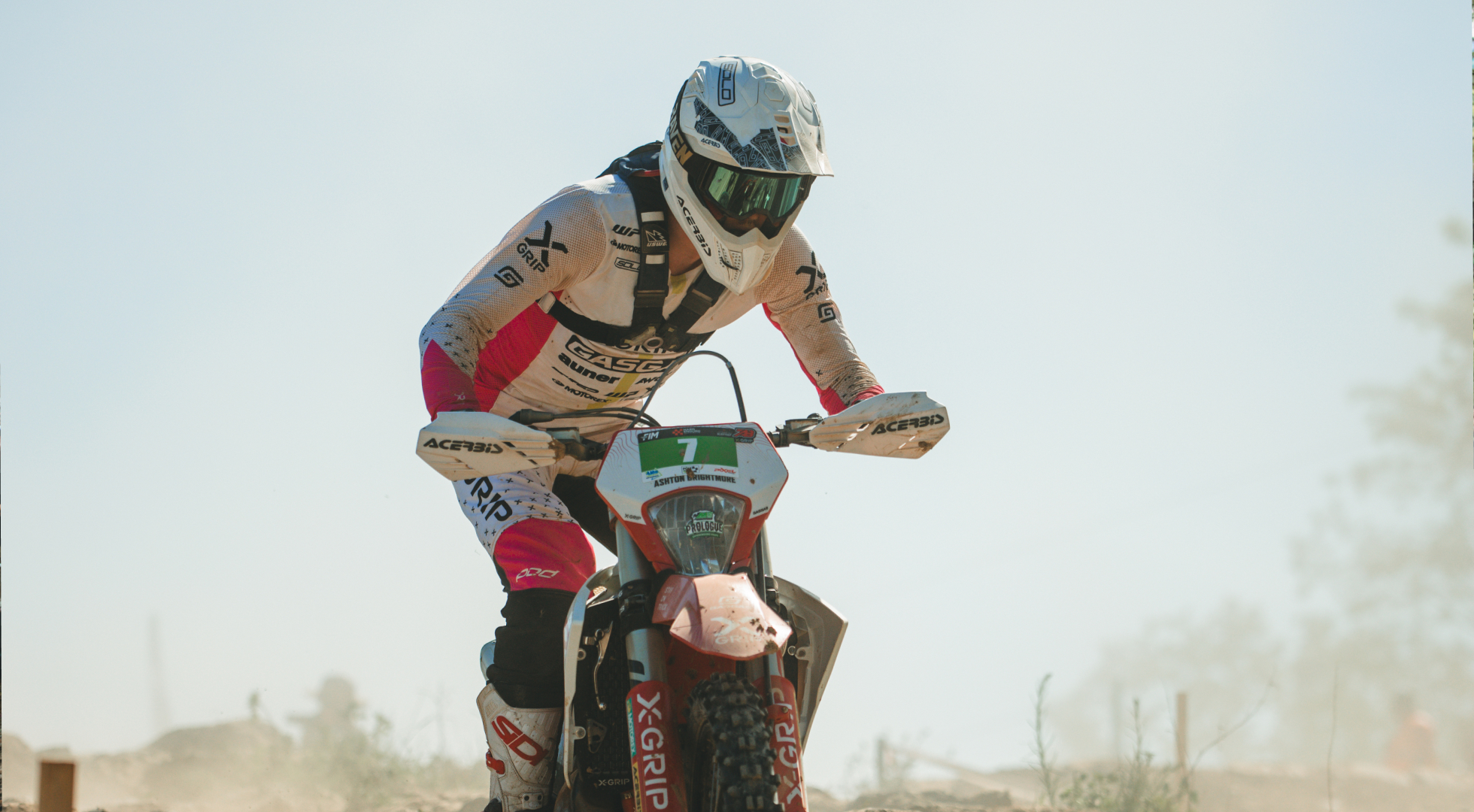 Hard Enduro rider charging through the desert dust