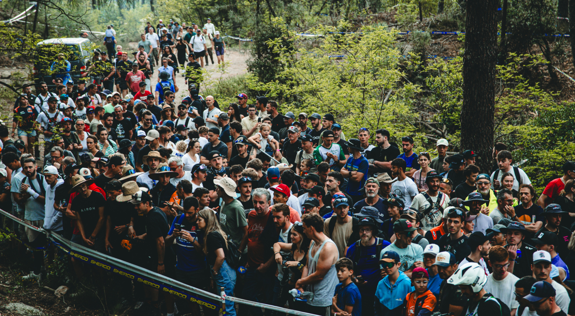Packed crowd of Hard Enduro fans lining a forest section